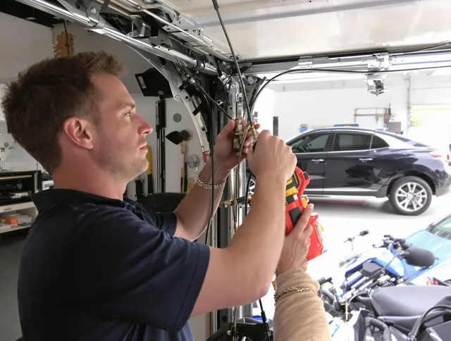 Pineville Garage Door Repair safety certified technician performing cable replacement in Pineville