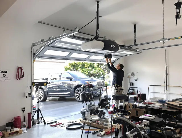 Pineville Garage Door Repair specialist installing smart garage door opener system in Pineville home