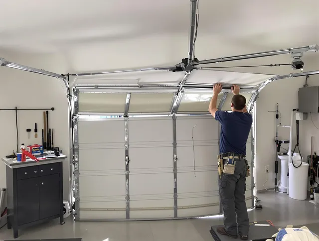 Pineville Garage Door Repair specialist performing precise section replacement on Pineville garage door