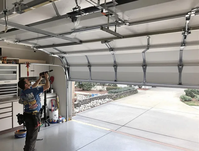 Garage door track repair service by Pineville Garage Door Repair in Pineville